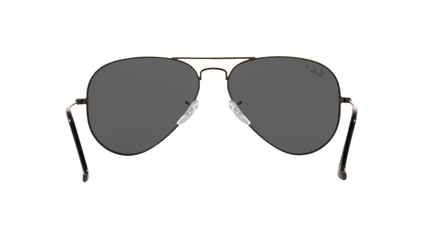 Aviator sunglasses with dark lenses on a white background