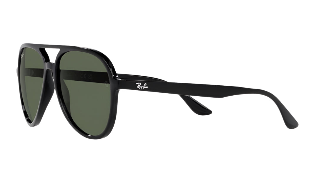 Black sunglasses with green lenses on a white background