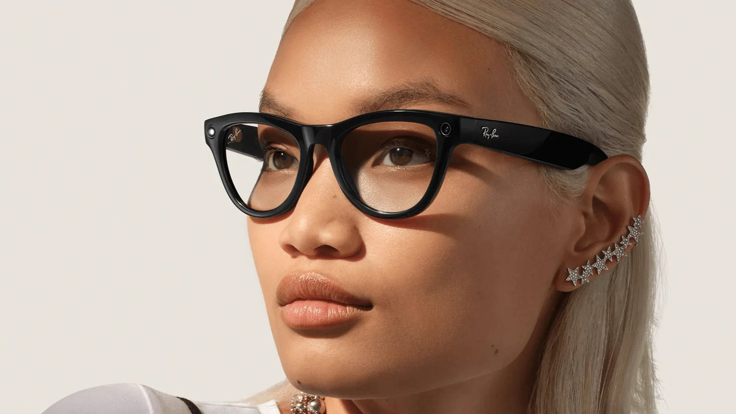 Woman wearing black Ray-Ban Meta Skyler cat-eye glasses with a neutral background