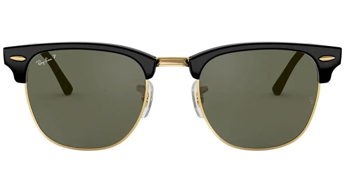 A pair of Ray-Ban RB3016 901/58 Clubmaster sunglasses featuring a black upper frame, gold metal rims, and G-15 polarized green lenses.