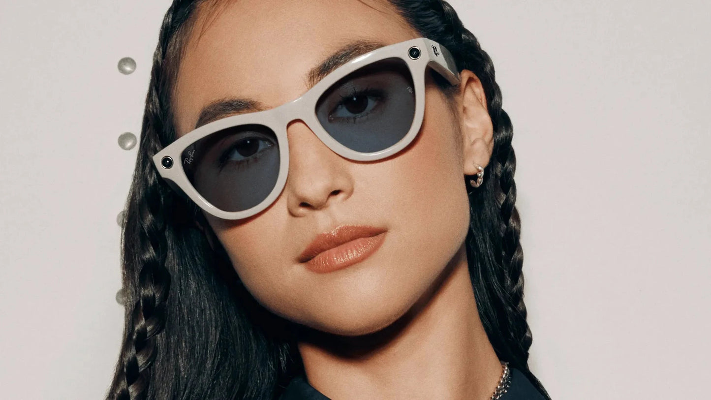 Woman wearing Ray‑Ban Meta Skyler RW4010 6700MF sunglasses with a plain background