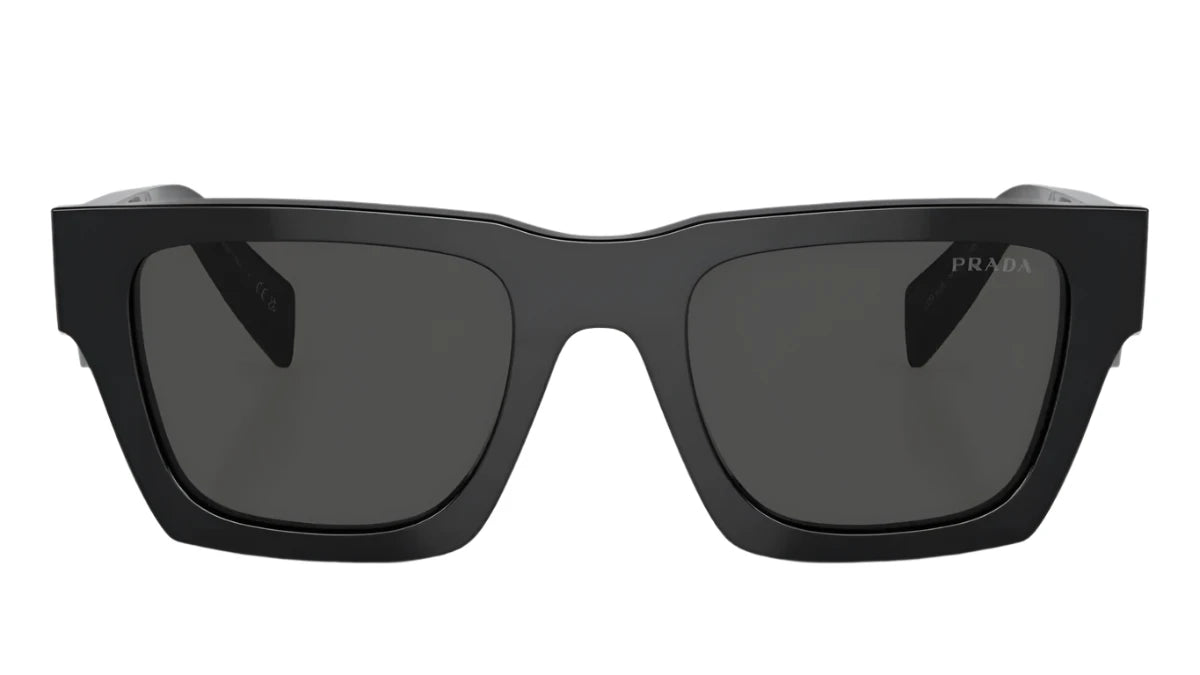 Front-facing view of PRADA SPR A06 16K 08Z sunglasses with dark lenses and sharp, structured edges.