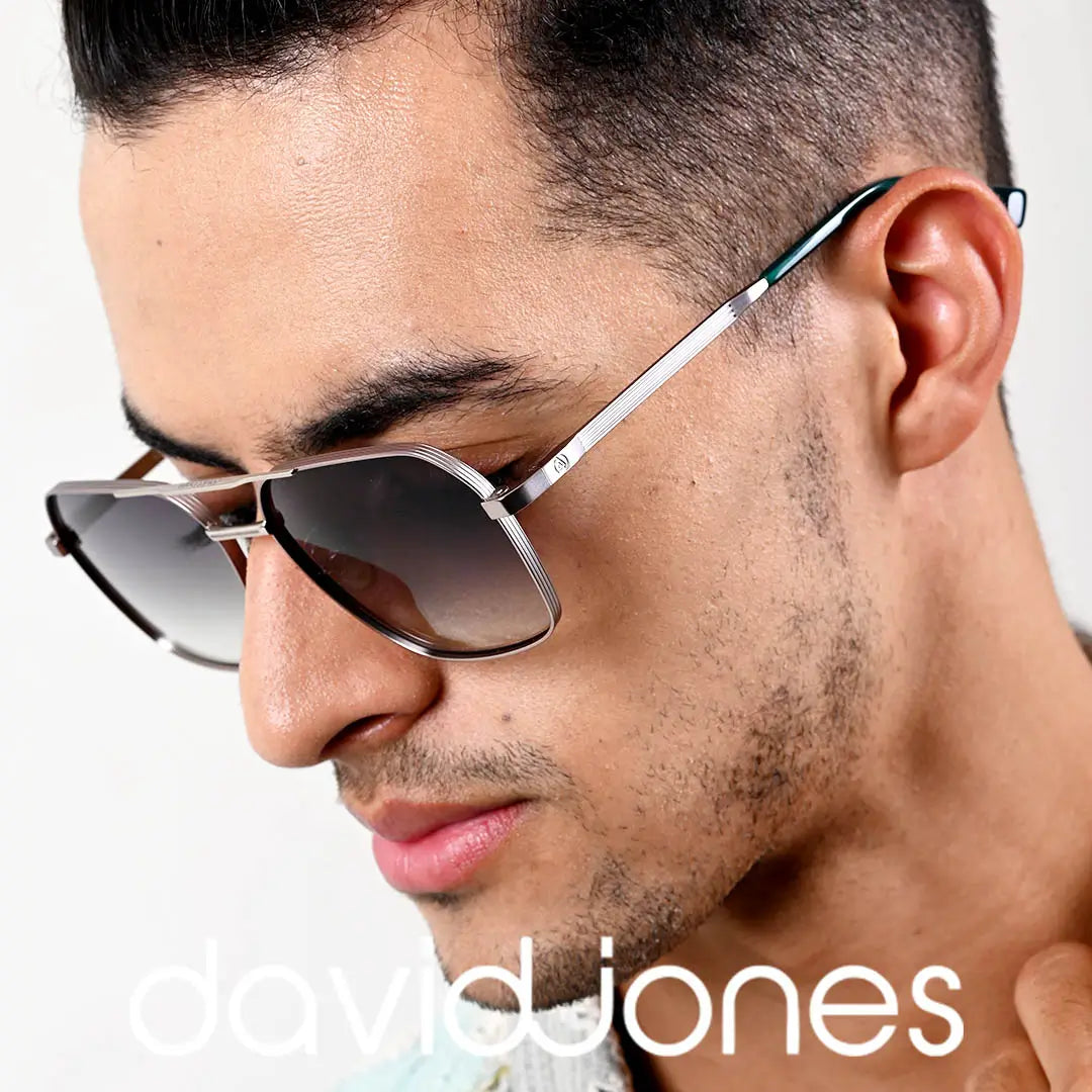 Close-up of a man wearing David Jones aviator sunglasses with sleek silver frames and gradient lenses, showcasing modern style and sophistication