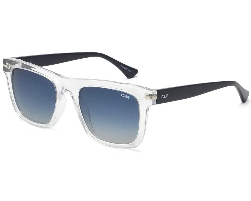 Angled side view of IDEE square sunglasses, showcasing the clear frame, black temples, and blue gradient lenses.