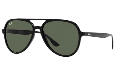 Black sunglasses with green lenses on a white background