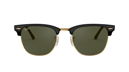Sunglasses with black frame and green lenses on a white background