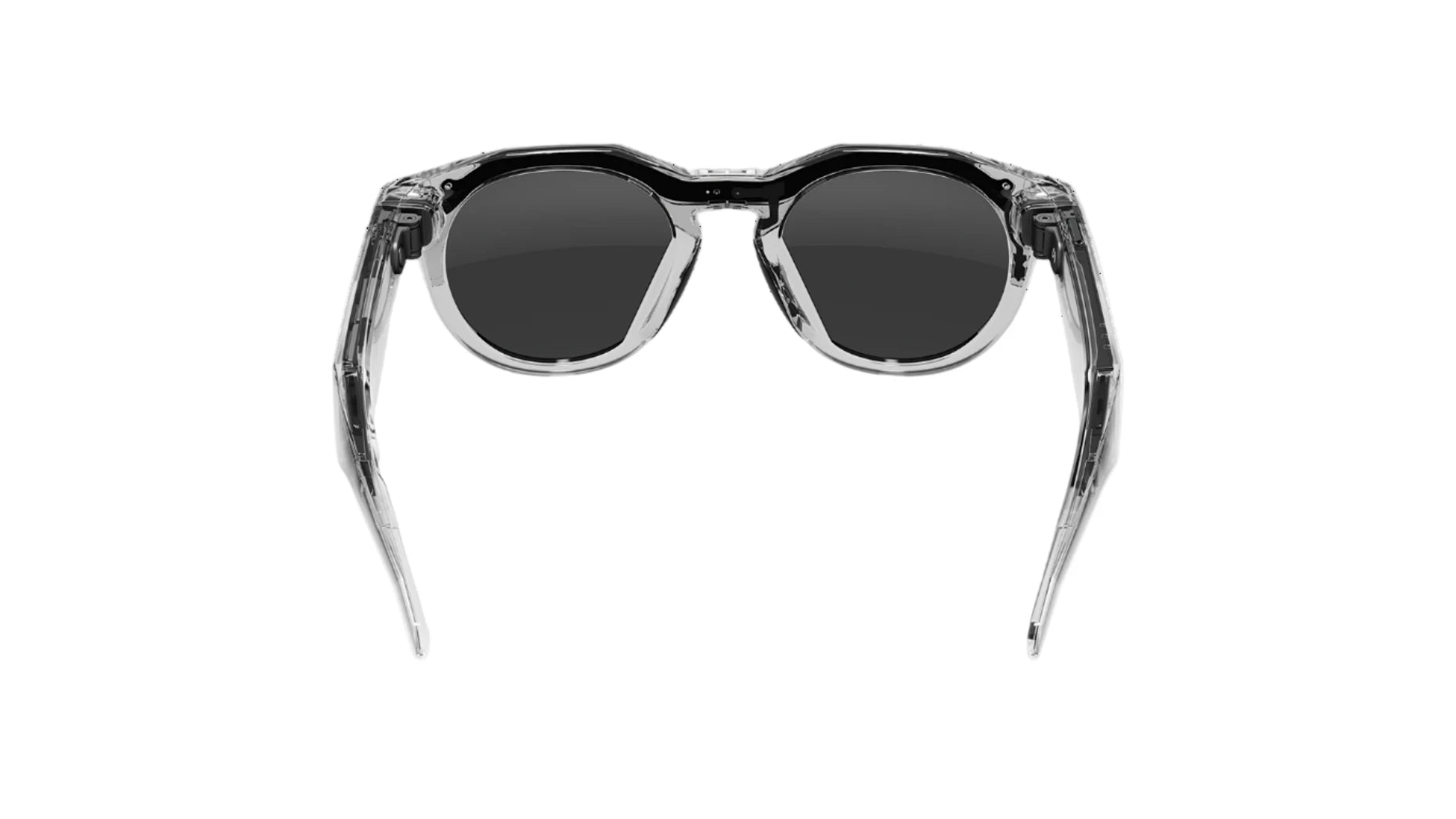 Sunglasses with black lenses and transparent frame on a white background